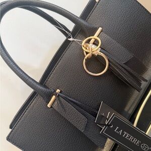 La Terre Black Handbag with Gold Accents